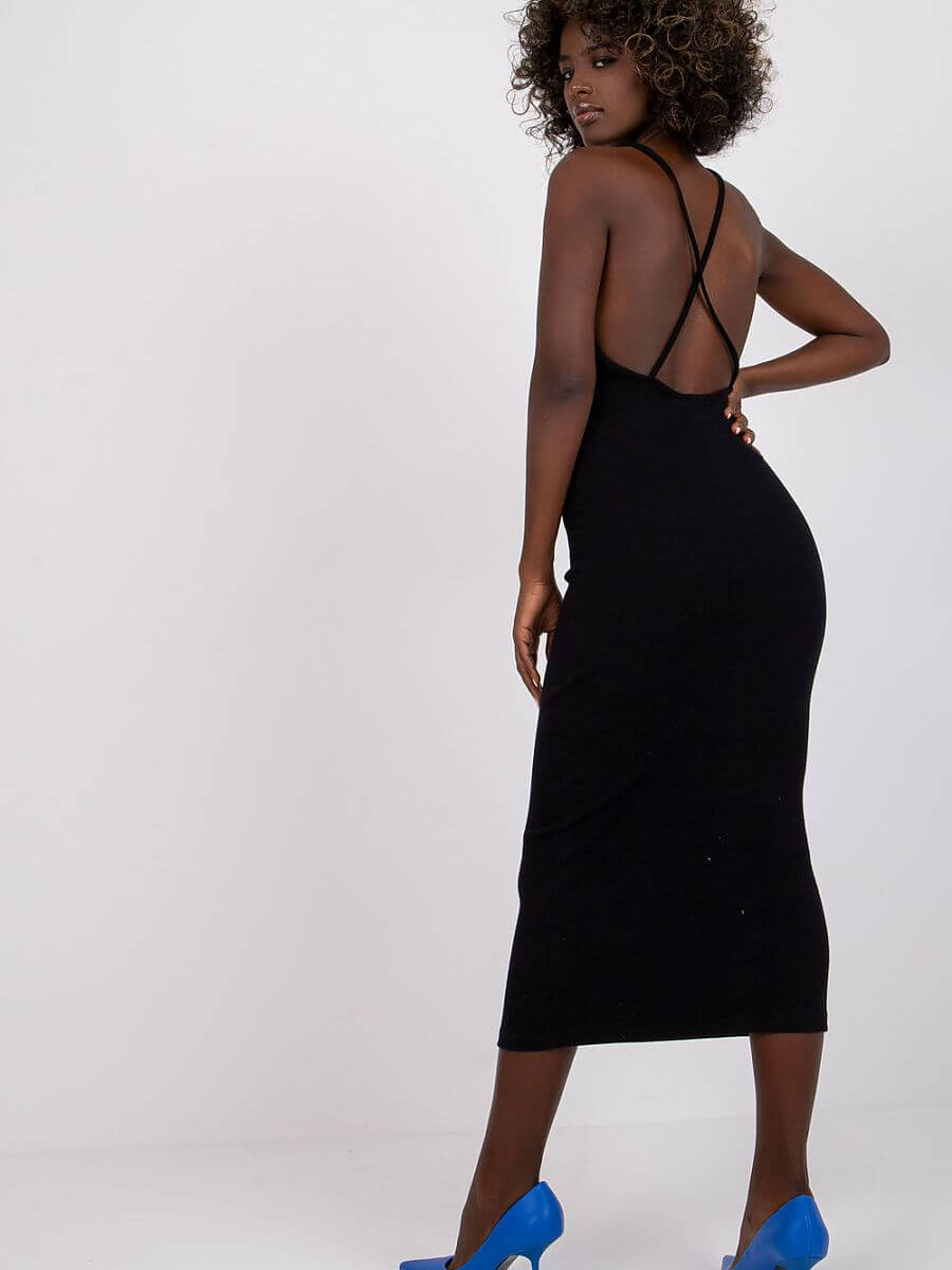 Back view of a woman wearing a summer pencil dress with blue heels, showcasing its sleek design and flattering fit.