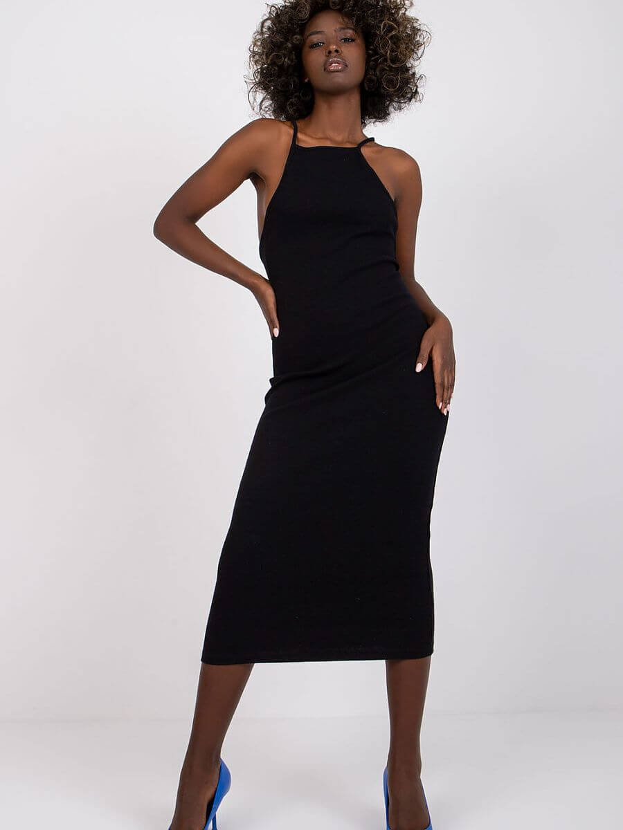 Model wearing a summer pencil dress, showcasing a flattering fit and ribbed texture, ideal for summer style.