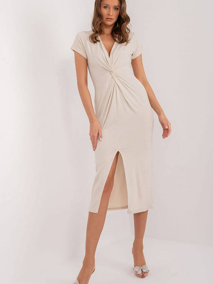 Elegant everyday daydress featuring a twisted front design and side slit for a chic look.