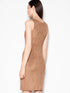 Back view of a woman wearing a suede evening dress in brown, highlighting the elegant design and soft fabric.